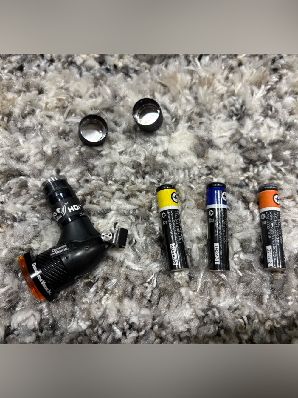 Designs for Vision mini head light with batteries.